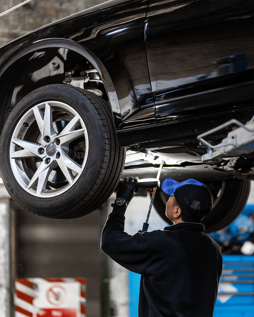 Mechanic inspecting a car